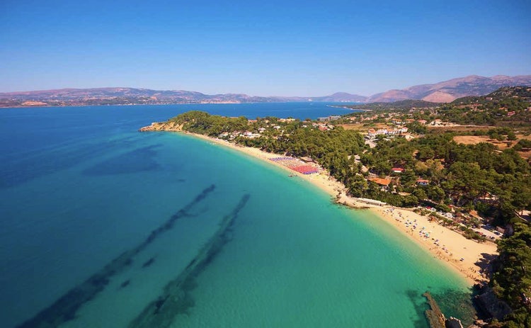 Panoramic shot of Makris Gialos beach in Kefalonia, Greece, showing the sandy shore and turquoise colored sea