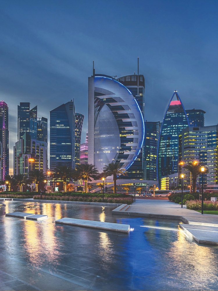 A photograph of the Doha cityscape at night