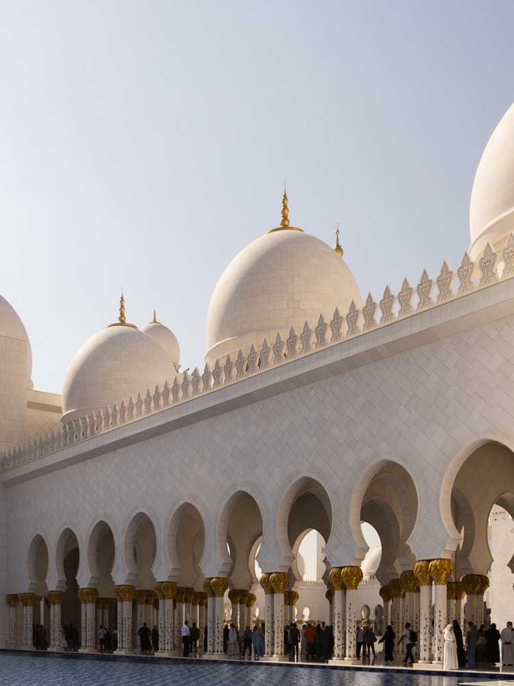 A photograph taken at an angle of the Grand Mosque in Abu Dhabi, UAE